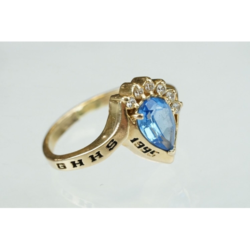 257 - Smoky quartz 9ct yellow gold ring, size Q; rose metal ring of clasped hands, ring size K; and a blue... 