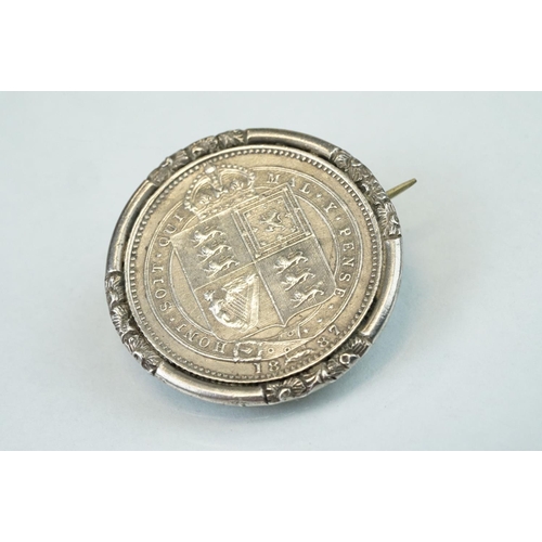 100 - Coin brooches to include two Victorian shield back coins, together with enamelled silver pendant med... 