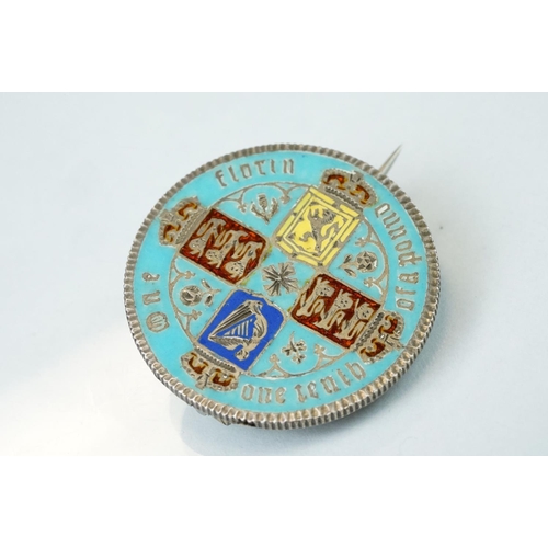 100 - Coin brooches to include two Victorian shield back coins, together with enamelled silver pendant med... 