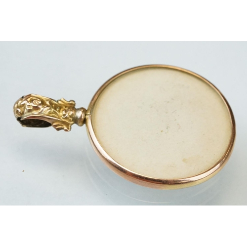 168 - Late Victorian / Edwardian 9ct yellow gold portrait fob, repoussé foliate decoration to the bale; to... 