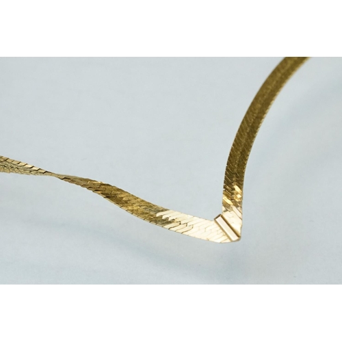 172 - 9ct gold wishbone necklace, together with a pair of 18ct yellow gold stud earrings, and two single 9... 