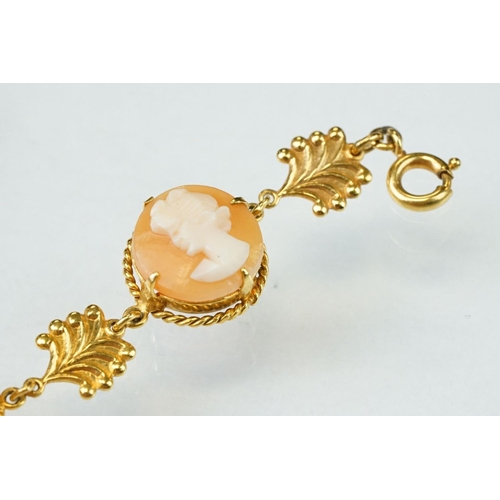 173 - Shell cameo 9ct yellow gold bracelet, six round cameo panels each depicting a female head, claw sett... 