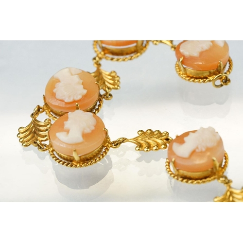 173 - Shell cameo 9ct yellow gold bracelet, six round cameo panels each depicting a female head, claw sett... 