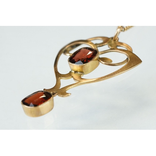 175 - Art Nouveau garnet 9ct gold pendant, two oval cushion cut garnets, rubover set, measuring approx 8mm... 