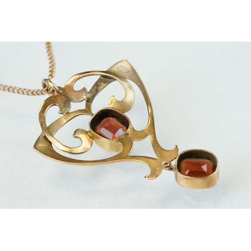 175 - Art Nouveau garnet 9ct gold pendant, two oval cushion cut garnets, rubover set, measuring approx 8mm... 