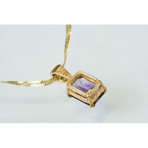 176 - Amethyst 9ct yellow gold pendant necklace, the rectangular cut amethyst measuring approx 7mm x 5mm, ... 