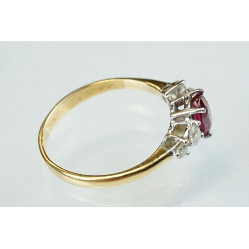 177 - Ruby and diamond yellow and white gold ring, hallmarks rubbed, oval mixed cut ruby, dimensions appro... 