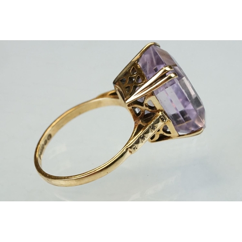 178 - Amethyst 9ct yellow gold dress ring, the rectangular mixed cut amethyst measuring approx 13.5mm x 11... 