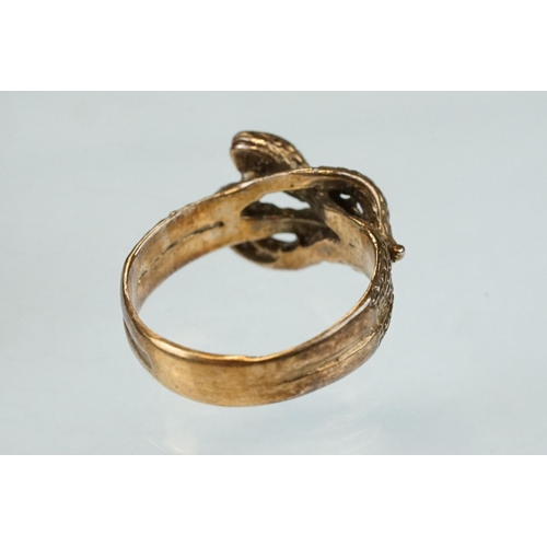 262 - 9ct rose gold ring modelled as two entwined snakes, width at widest point approx 10mm, ring size N½