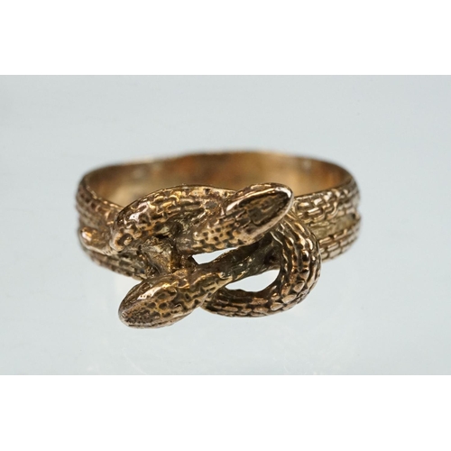 262 - 9ct rose gold ring modelled as two entwined snakes, width at widest point approx 10mm, ring size N½