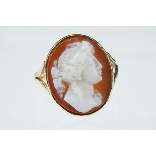 265 - Cameo 18ct yellow gold ring, the oval cameo depicting female profile, rubover set, v shaped shoulder... 