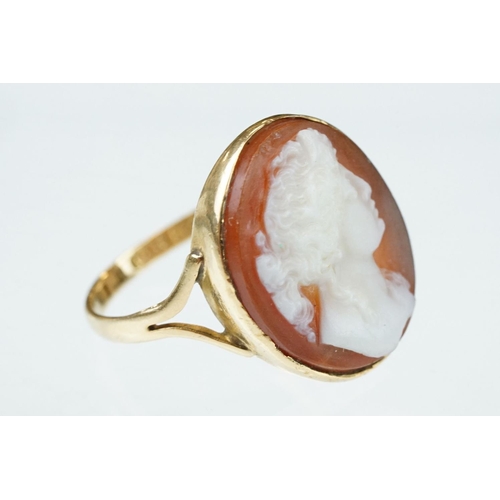 265 - Cameo 18ct yellow gold ring, the oval cameo depicting female profile, rubover set, v shaped shoulder... 