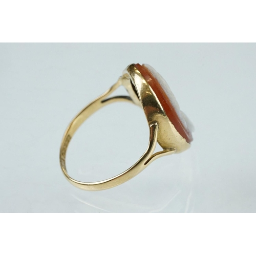 265 - Cameo 18ct yellow gold ring, the oval cameo depicting female profile, rubover set, v shaped shoulder... 