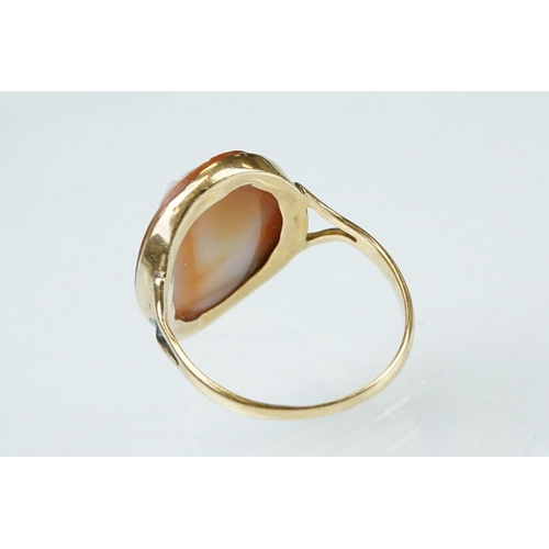 265 - Cameo 18ct yellow gold ring, the oval cameo depicting female profile, rubover set, v shaped shoulder... 