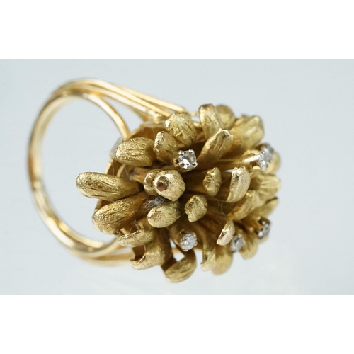 266 - Diamond yellow metal fancy cluster ring, textured stylised leaves in cluster formation, six small ro... 