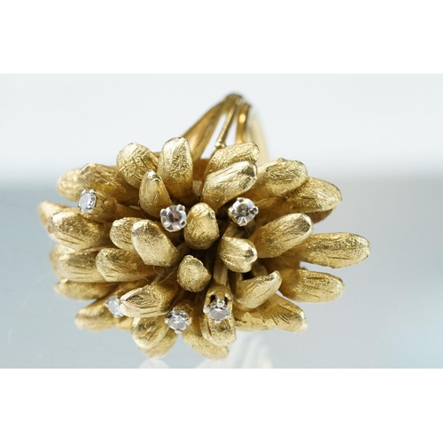 266 - Diamond yellow metal fancy cluster ring, textured stylised leaves in cluster formation, six small ro... 