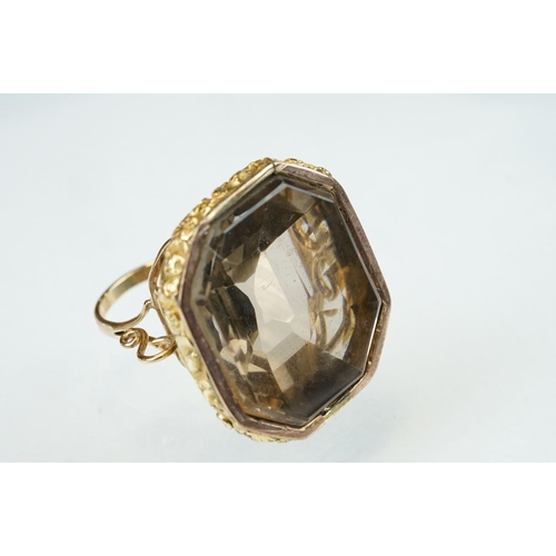 275 - Smoky quartz gold plated and yellow metal ring, the large octagonal mixed cut smoky quartz measuring... 