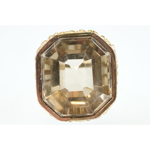 275 - Smoky quartz gold plated and yellow metal ring, the large octagonal mixed cut smoky quartz measuring... 