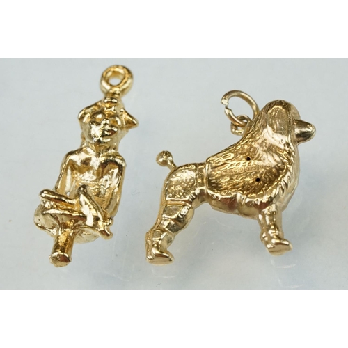 279 - Eight 9ct yellow gold charms together with two yellow metal charms (10)