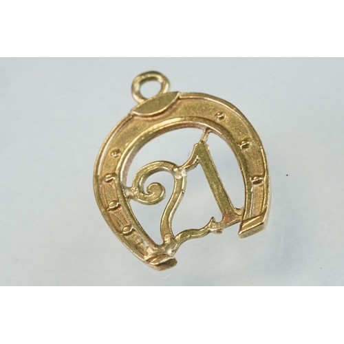 279 - Eight 9ct yellow gold charms together with two yellow metal charms (10)