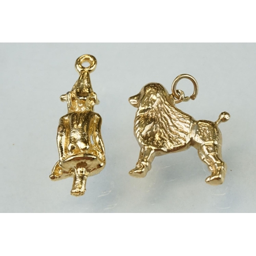 279 - Eight 9ct yellow gold charms together with two yellow metal charms (10)