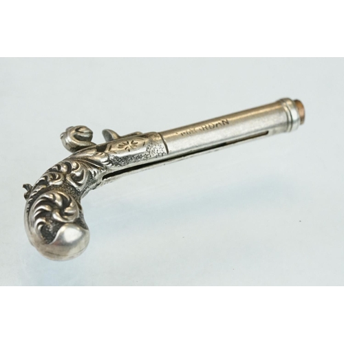 282 - Sampson Mordan white metal novelty propelling pencil modelled as a pistol, the shaft engraved 8 July... 