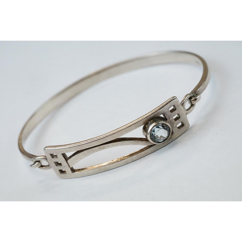 288 - Blue topaz silver bangle, Rennie Mackintosh style; three silver hinged bangles together with a furth... 