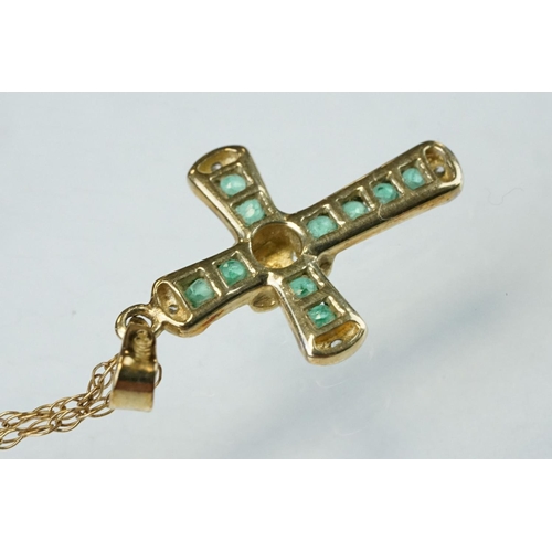 295 - Emerald and diamond 9ct yellow and white gold cross pendant and chain, ten small round mixed cut eme... 