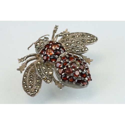 297 - Garnet and marcasite silver insect brooch, the body full set with round mixed cut garnets, the wings... 