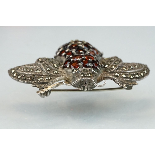 297 - Garnet and marcasite silver insect brooch, the body full set with round mixed cut garnets, the wings... 