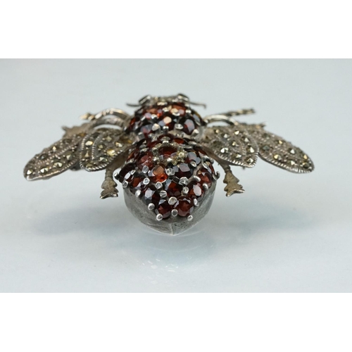 297 - Garnet and marcasite silver insect brooch, the body full set with round mixed cut garnets, the wings... 