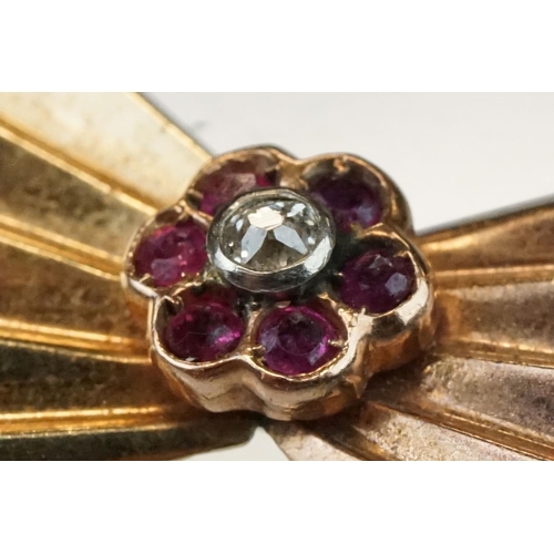 298 - Diamond and ruby yellow and rose metal fan brooch, diamond and ruby cluster to centre, diameter appr... 