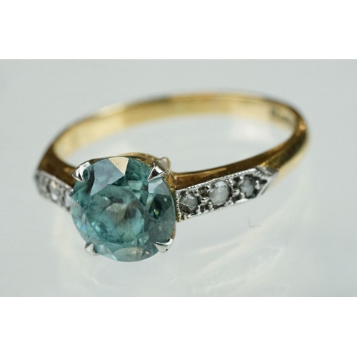 299 - Topaz and diamond 18ct yellow gold and platinum set ring, the round mixed cut blue topaz diameter ap... 