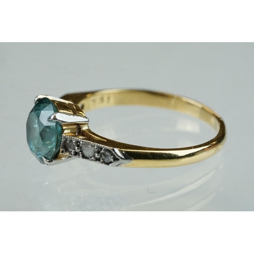 299 - Topaz and diamond 18ct yellow gold and platinum set ring, the round mixed cut blue topaz diameter ap... 