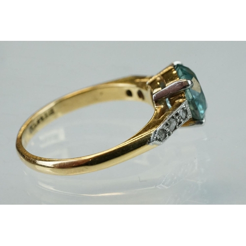 299 - Topaz and diamond 18ct yellow gold and platinum set ring, the round mixed cut blue topaz diameter ap... 