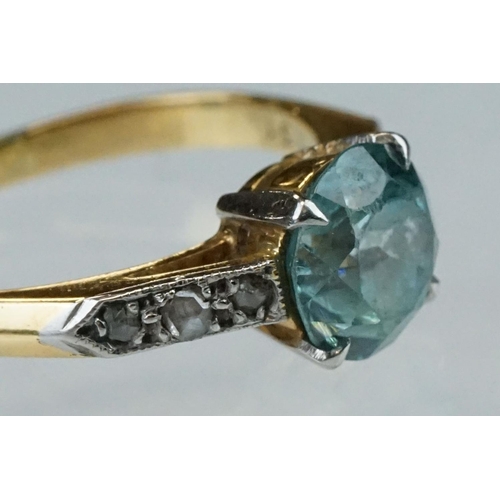 299 - Topaz and diamond 18ct yellow gold and platinum set ring, the round mixed cut blue topaz diameter ap... 