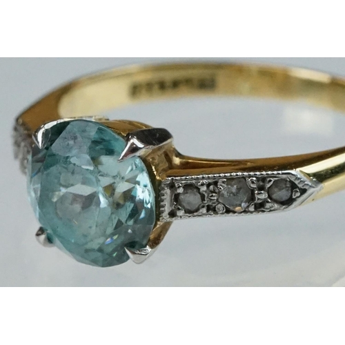 299 - Topaz and diamond 18ct yellow gold and platinum set ring, the round mixed cut blue topaz diameter ap... 