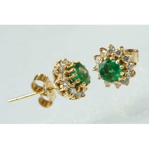 35 - Emerald and diamond 18ct yellow gold cluster earrings, the round mixed cut emerald measuring approx ... 