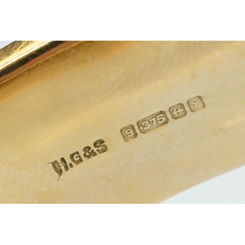 36 - 9ct yellow gold hinged bangle, engraved foliate scroll decoration to the upper half, tongue and box ... 