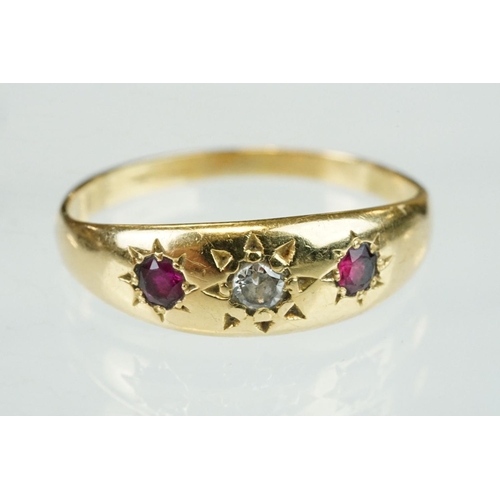 364 - Diamond and ruby 18ct yellow gold three stone ring, the central round old cut diamond weighing appro... 