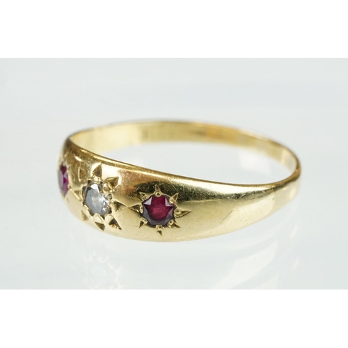 364 - Diamond and ruby 18ct yellow gold three stone ring, the central round old cut diamond weighing appro... 