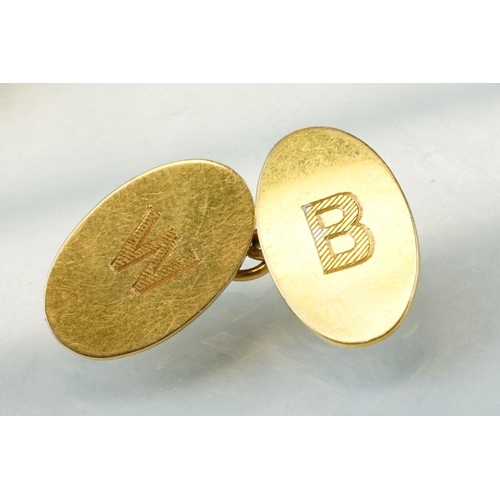 39A - Pair of 18ct yellow gold cufflinks, oval panels, plain polished design with engraved initials, chain... 