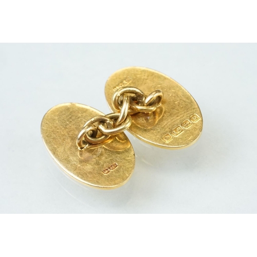 39A - Pair of 18ct yellow gold cufflinks, oval panels, plain polished design with engraved initials, chain... 