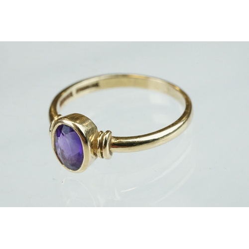 52 - Amethyst 9ct yellow gold ring, the oval mixed cut amethyst measuring approx 6.5mmx 4.5mm, rubover se... 