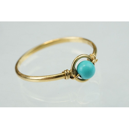 53 - Turquoise 18ct yellow gold ring, suspended central circular turquoise bead, diameter approx 4mm, hal... 