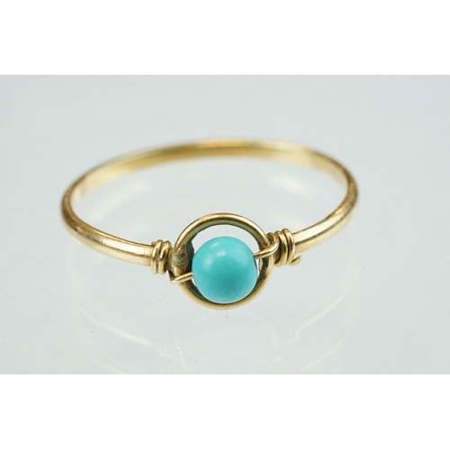 53 - Turquoise 18ct yellow gold ring, suspended central circular turquoise bead, diameter approx 4mm, hal... 