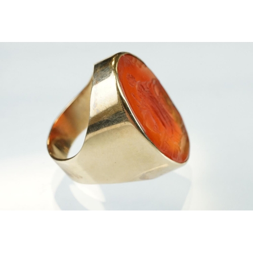 55 - Carnelian intaglio yellow metal ring, the intaglio depicting a Grecian lady with urn and monogrammed... 