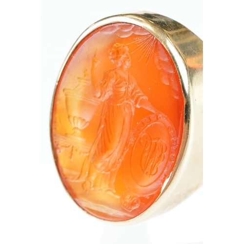 55 - Carnelian intaglio yellow metal ring, the intaglio depicting a Grecian lady with urn and monogrammed... 