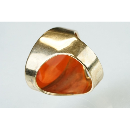 55 - Carnelian intaglio yellow metal ring, the intaglio depicting a Grecian lady with urn and monogrammed... 