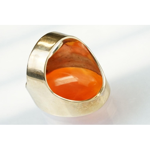 55 - Carnelian intaglio yellow metal ring, the intaglio depicting a Grecian lady with urn and monogrammed... 